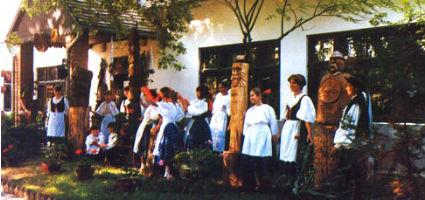 Preserving Tradition in front of the Village House