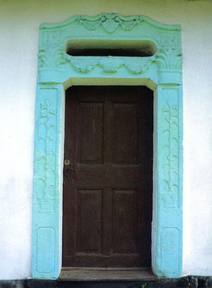The carved entrance of the region house