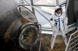 Farkas Bertalan stands next to the space craft.