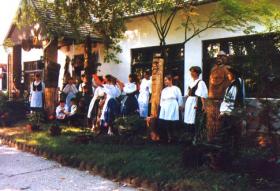 Preserving Tradition in front of the Village House